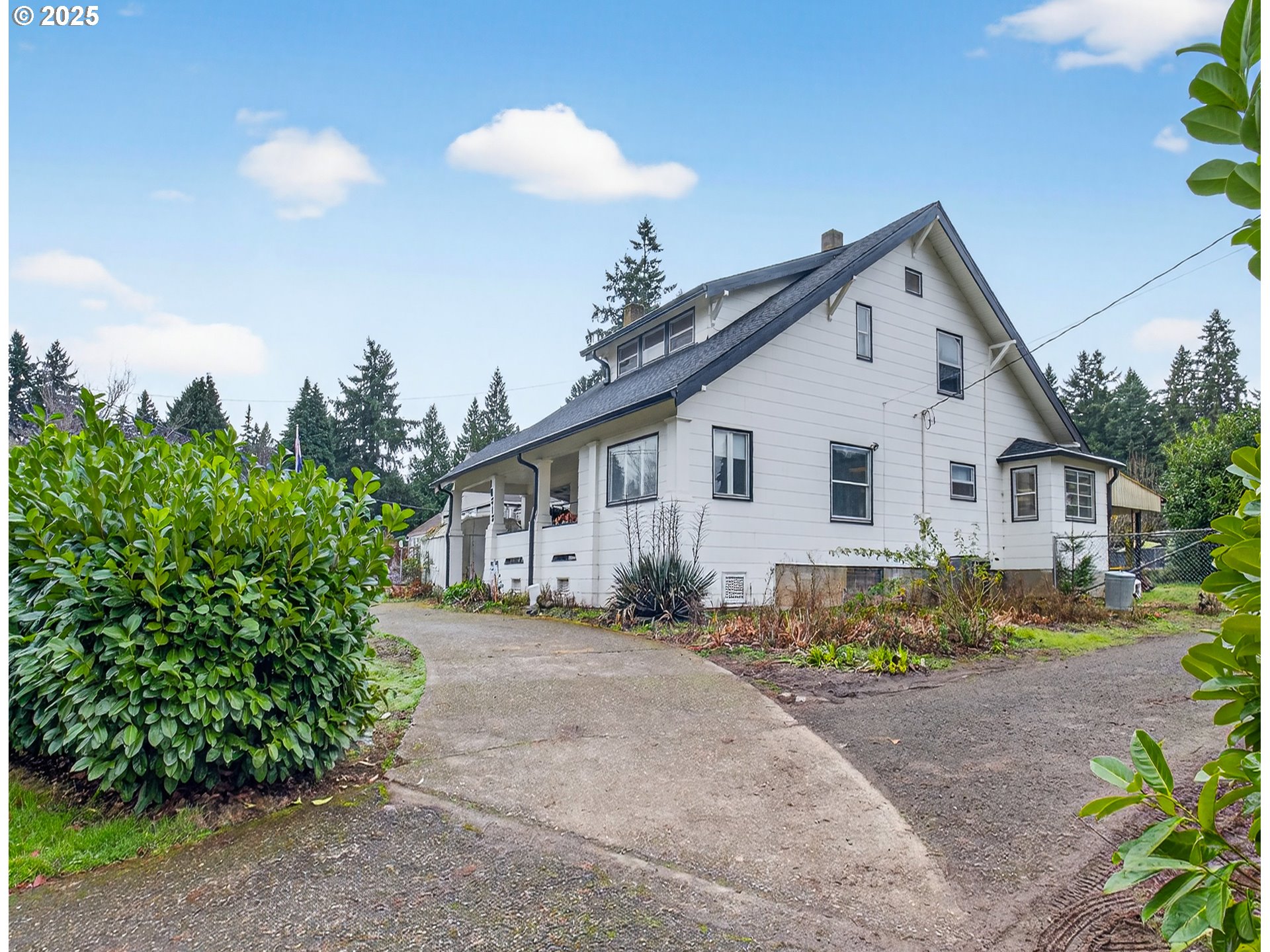18515 Southeast River Road Milwaukie, OR 97267 - Photo 2 of 41 a view of a white house with a yard and sitting area