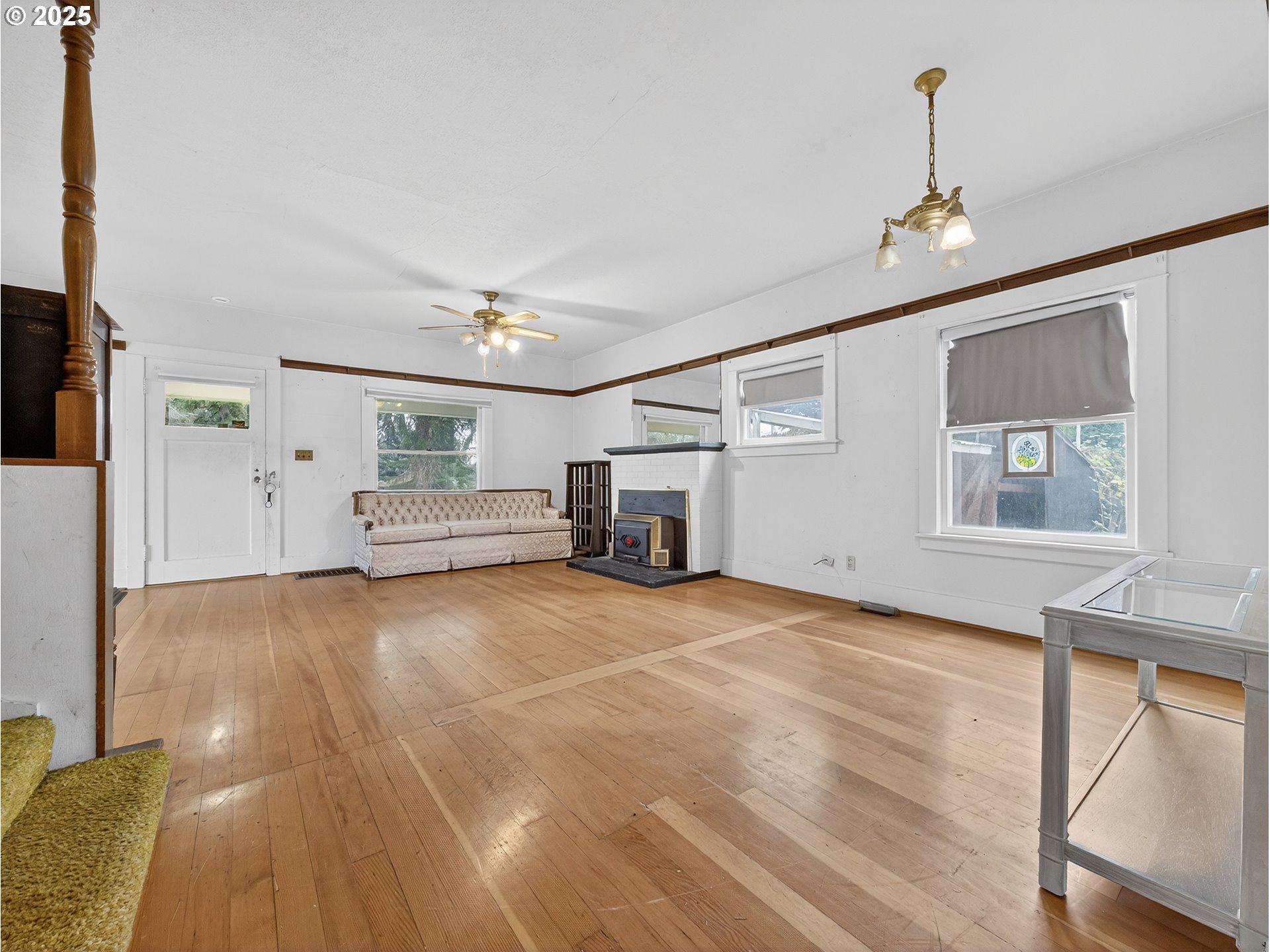 18515 Southeast River Road Milwaukie, OR 97267 - Photo 9 of 41 a view of empty room with wooden floor and fan