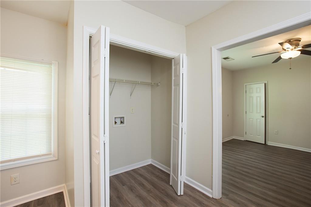 1049 Sims Street Southwest Atlanta, GA 30310 - Photo 4 of 9 a view of a hallway with wooden floor