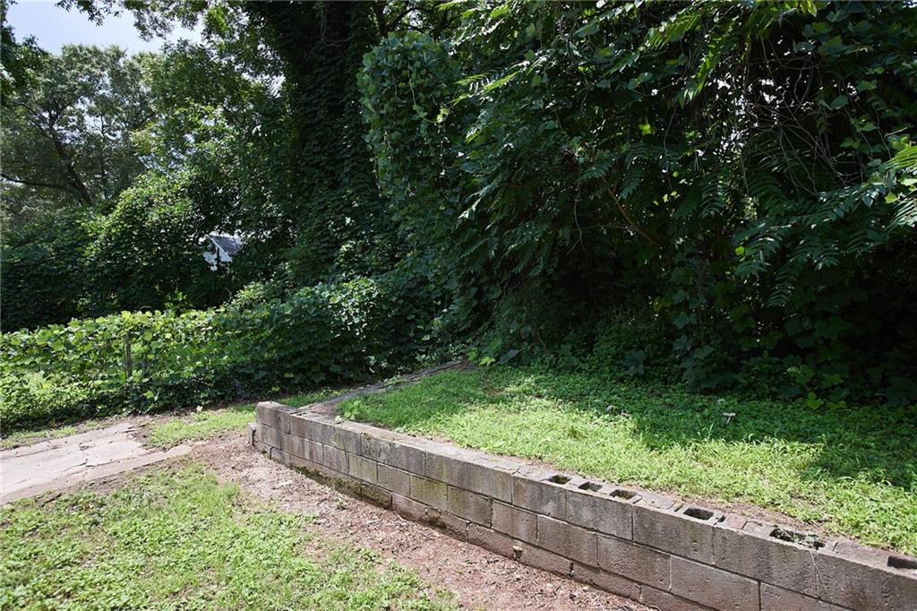 1049 Sims Street Southwest Atlanta, GA 30310 - Photo 9 of 9 a view of a garden with wooden fence