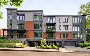a front view of residential houses with stairs and yard