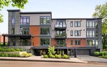 a front view of residential houses with stairs and yard