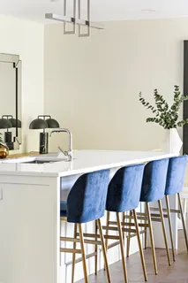 a kitchen with a table and chairs