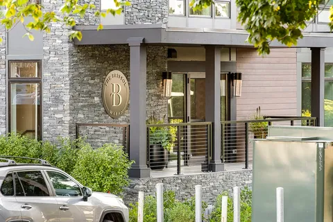 a front view of a house with parking