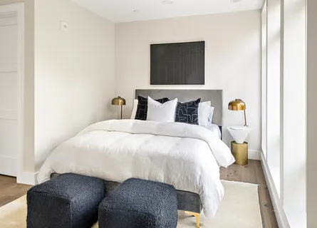 a bedroom with a bed and couch