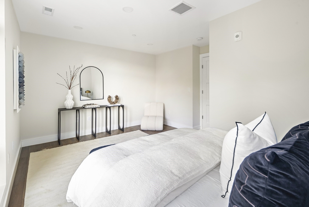 20 Kinmonth Road, Unit 201 Newton, MA 02468 - Photo 30 of 33 a bedroom with a bed and a sink