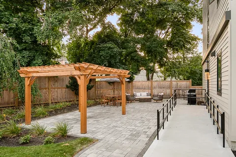 an outdoor space with seating area and slide