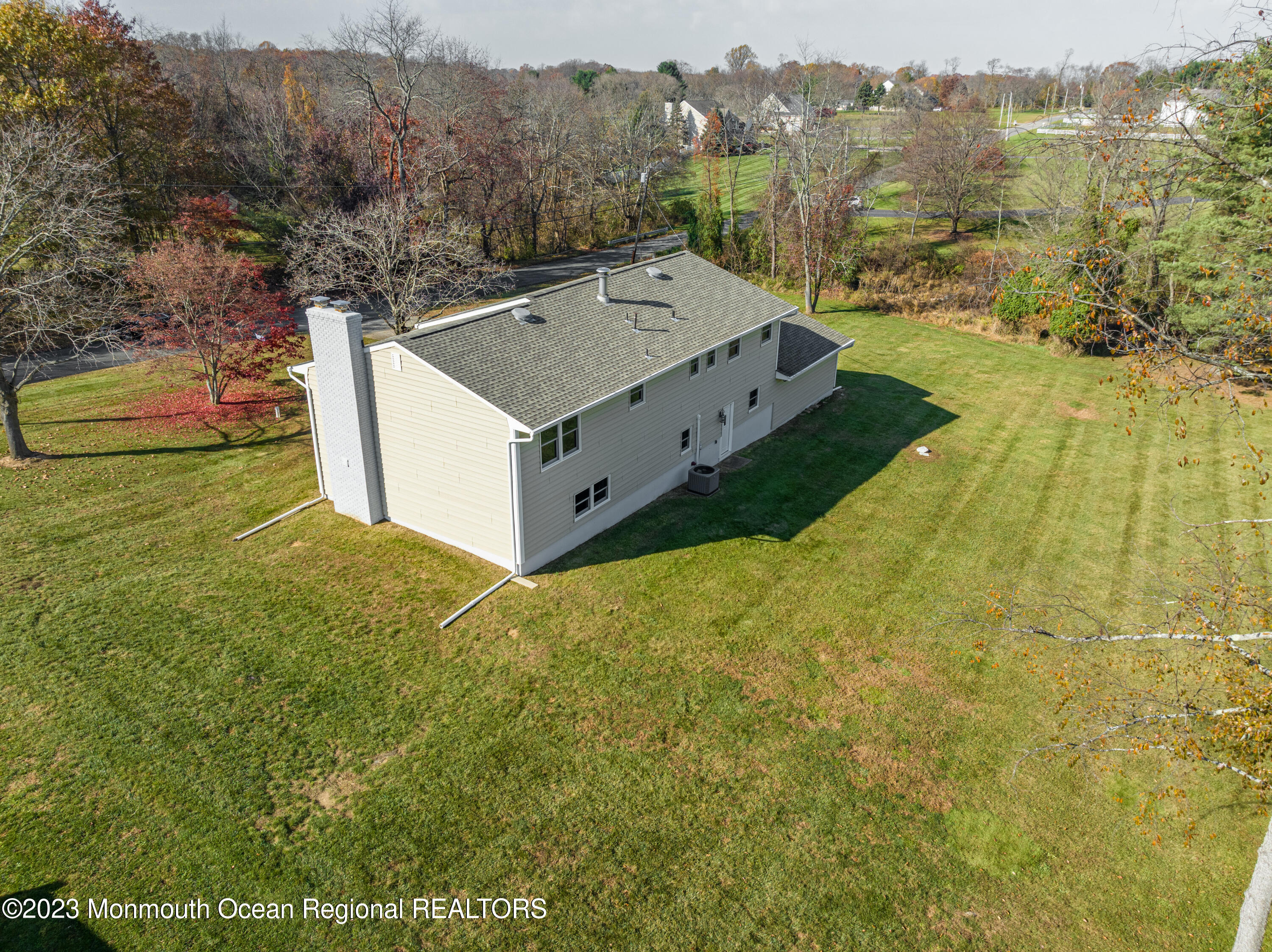 18 Forman Road Millstone Township, NJ 08535 - Photo 40 of 57 a view of a big house with a big yard and large trees