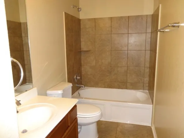 a bathroom with a sink a toilet and a bathtub