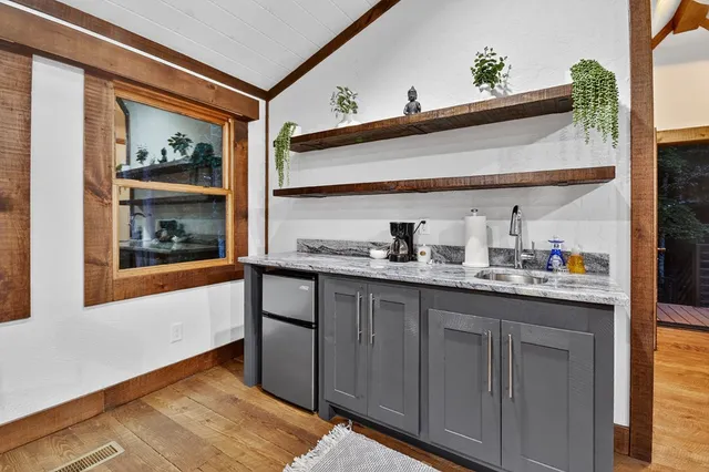 a utility room with cabinets dryer and washer
