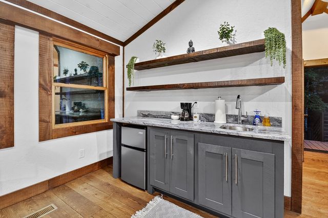 a living room with fireplace furniture and a flat screen tv