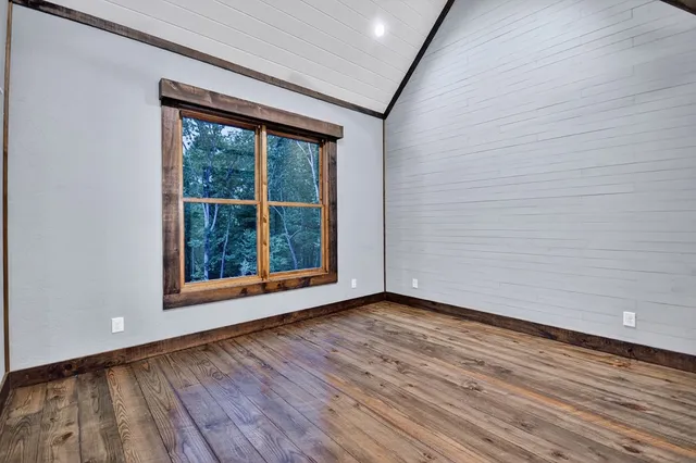 a living room with furniture and large windows