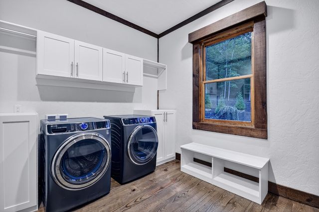 a bathroom with a toilet a sink and a mirror
