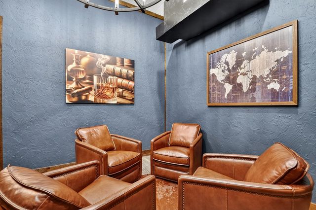 a kitchen with stainless steel appliances granite countertop a stove and a wooden floors