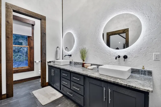 a kitchen with stainless steel appliances granite countertop a stove and a refrigerator