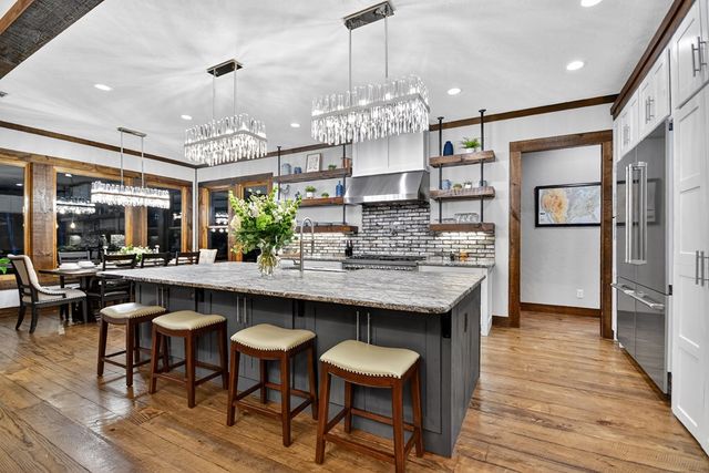 a large room with lots of furniture and a large window