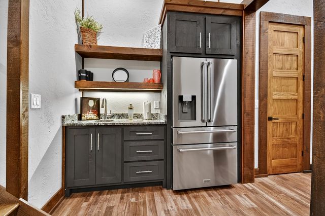 a bathroom with a double vanity sink mirror and bathtub