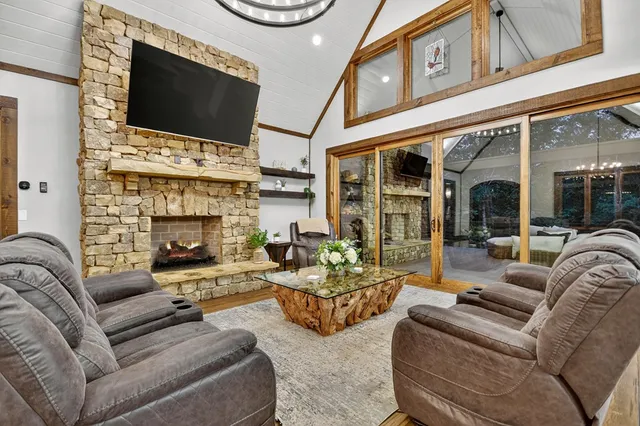 a living room with furniture and large windows