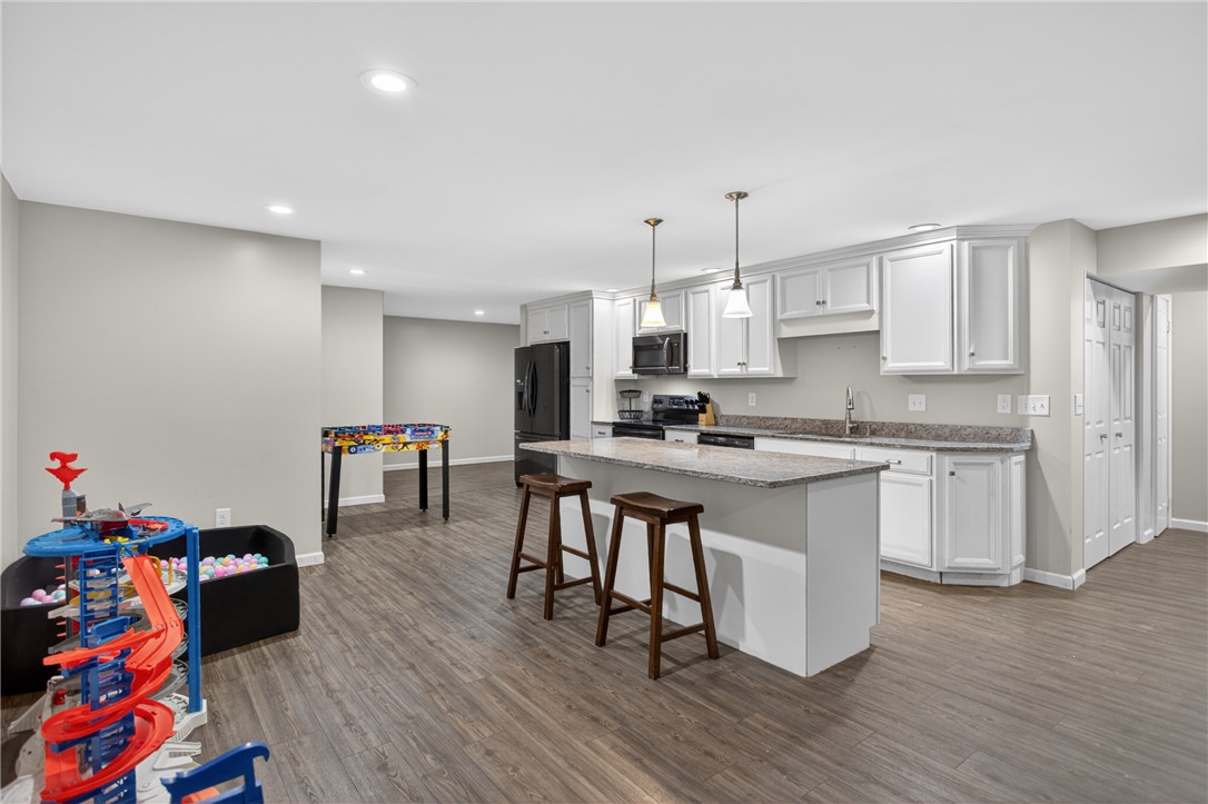 136 Loran Pointe Circle Seneca, SC 29672 - Photo 28 of 50 A streamlined kitchen layout offers an island with breakfast bar seating and ample counter space, perfect for everyday living.