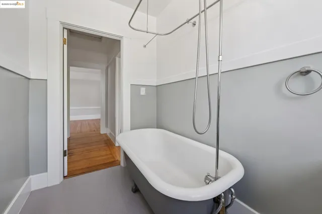 a bathroom with a tub and shower