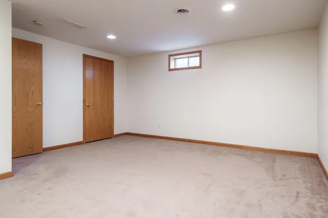 an empty room with a en suite bathroom