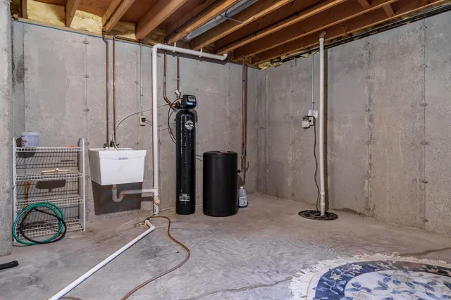 an aerial view of a couch with table and chairs
