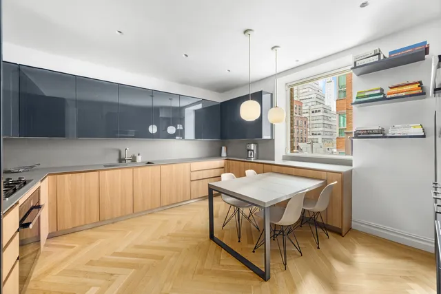 a view of a dining room with furniture and window
