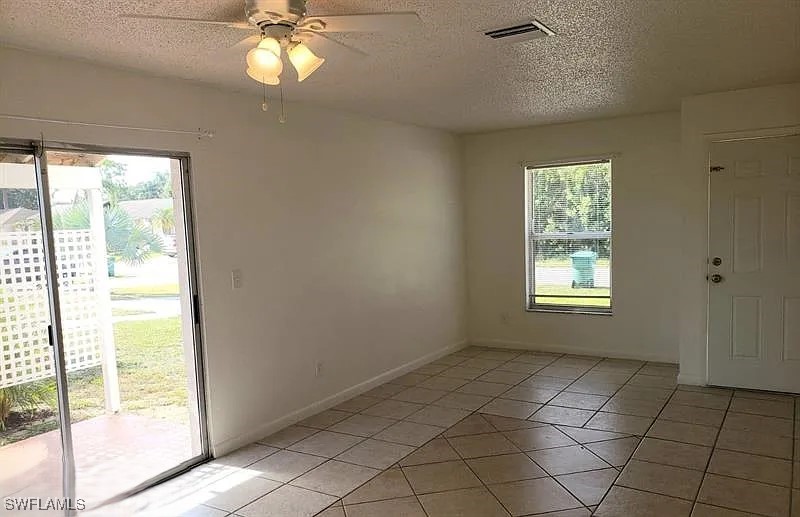 11216 Pendleton Avenue, Unit B Englewood, FL 34224 - Photo 3 of 10 a view of an empty room and window