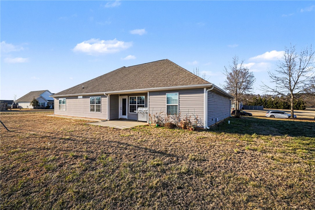 125 Apple Grove Drive Inman, SC 29349 - Photo 18 of 19 This spacious backyard offers ample outdoor living potential and privacy.