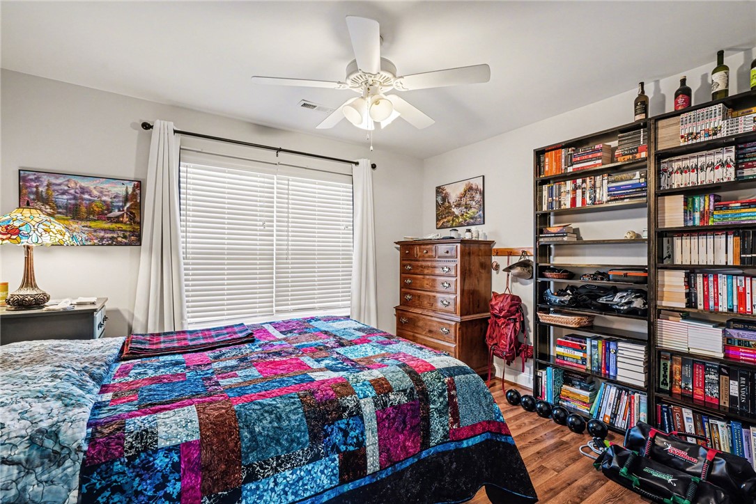125 Apple Grove Drive Inman, SC 29349 - Photo 10 of 19 This inviting bedroom features rich hardwood flooring and a ceiling fan for comfort.