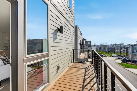 a balcony with view of residential house