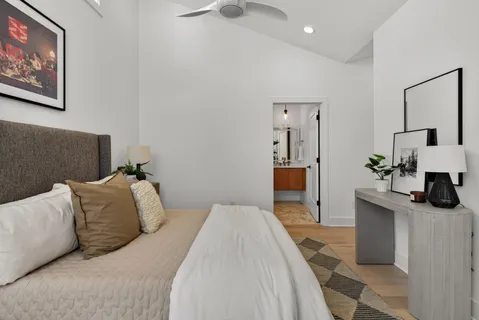 a bedroom with a bed and a couch