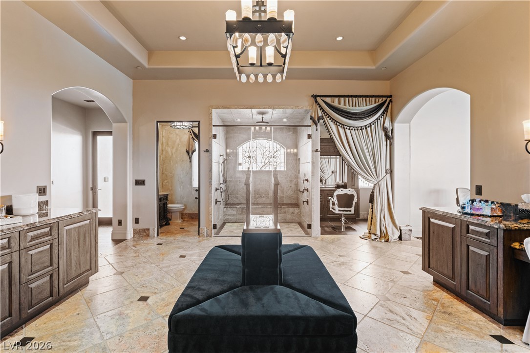 1123 Christian Road Henderson, NV 89002 - Photo 25 of 94 Indulge in a primary bathroom retreat with a spacious walk-in shower and elegant tile flooring.