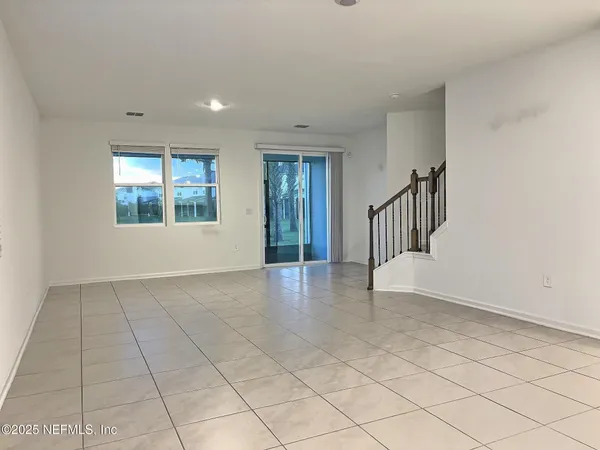 a view of an empty room and window