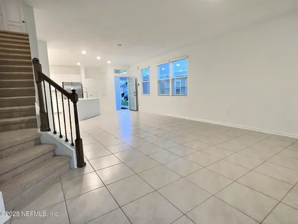 an entryway in a hall with a window