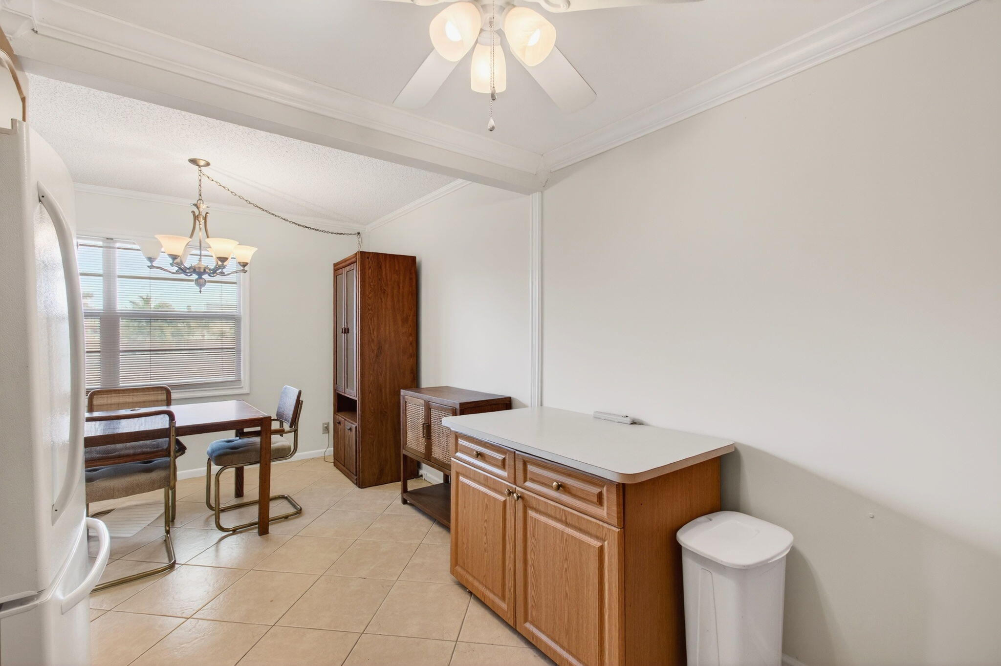 3007 Yarmouth C Boca Raton, FL 33434 - Photo 15 of 70 a room with stainless steel appliances kitchen island granite countertop furniture and a fireplace