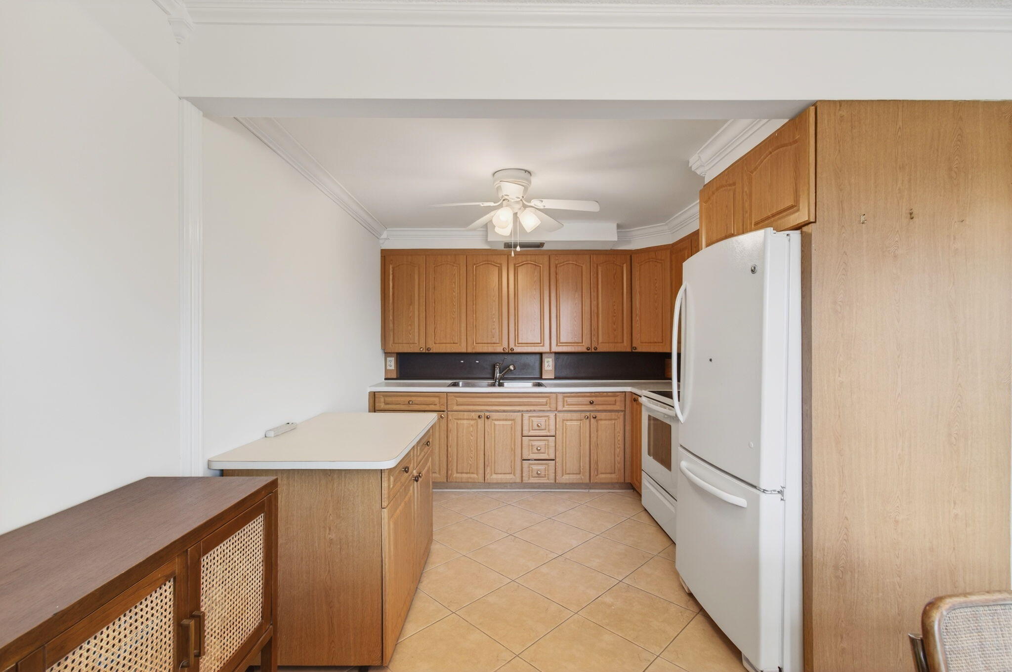 3007 Yarmouth C Boca Raton, FL 33434 - Photo 17 of 70 a kitchen with a refrigerator a stove and a microwave