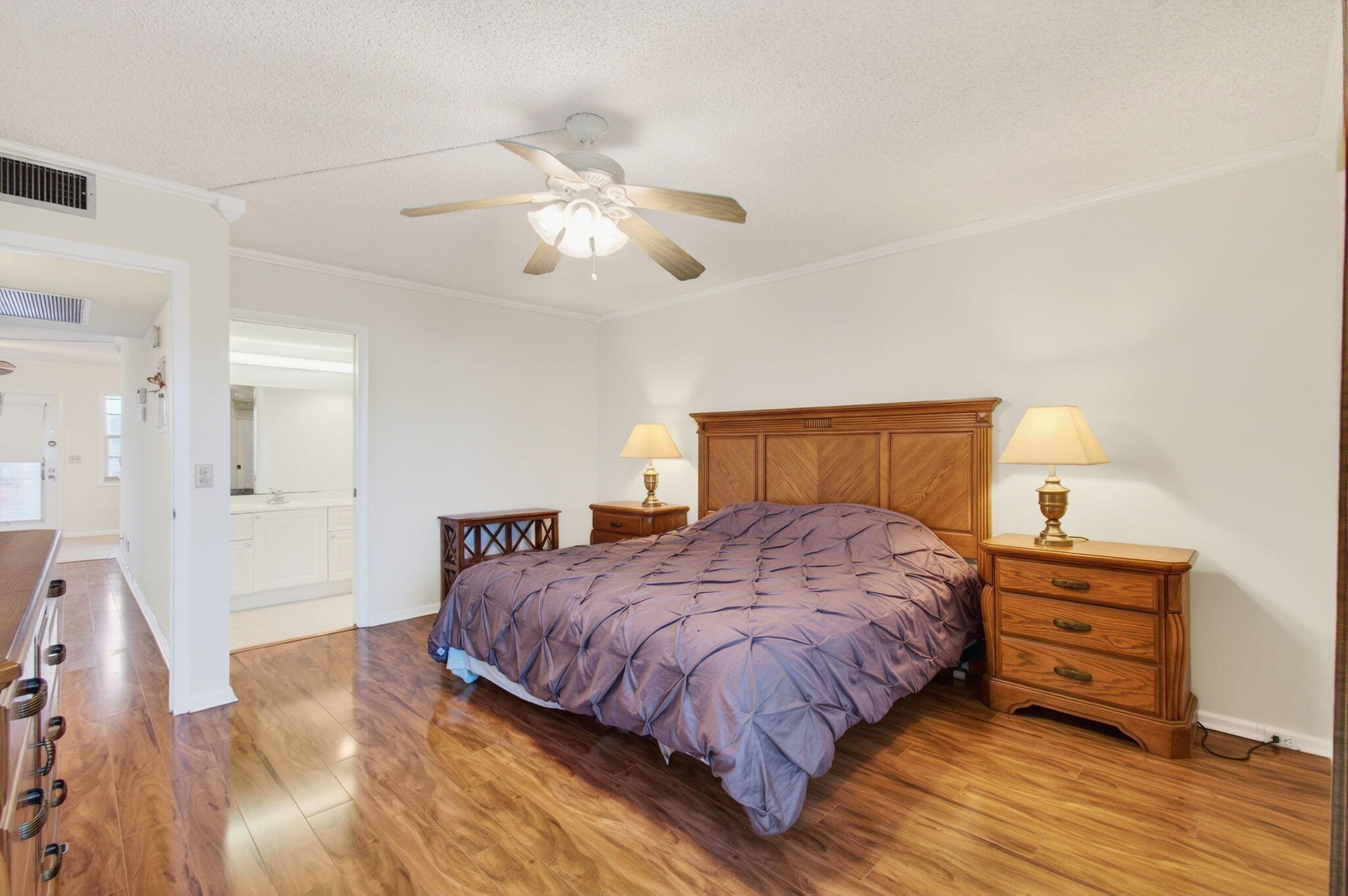 3007 Yarmouth C Boca Raton, FL 33434 - Photo 21 of 70 a bedroom with a bed and wooden floor