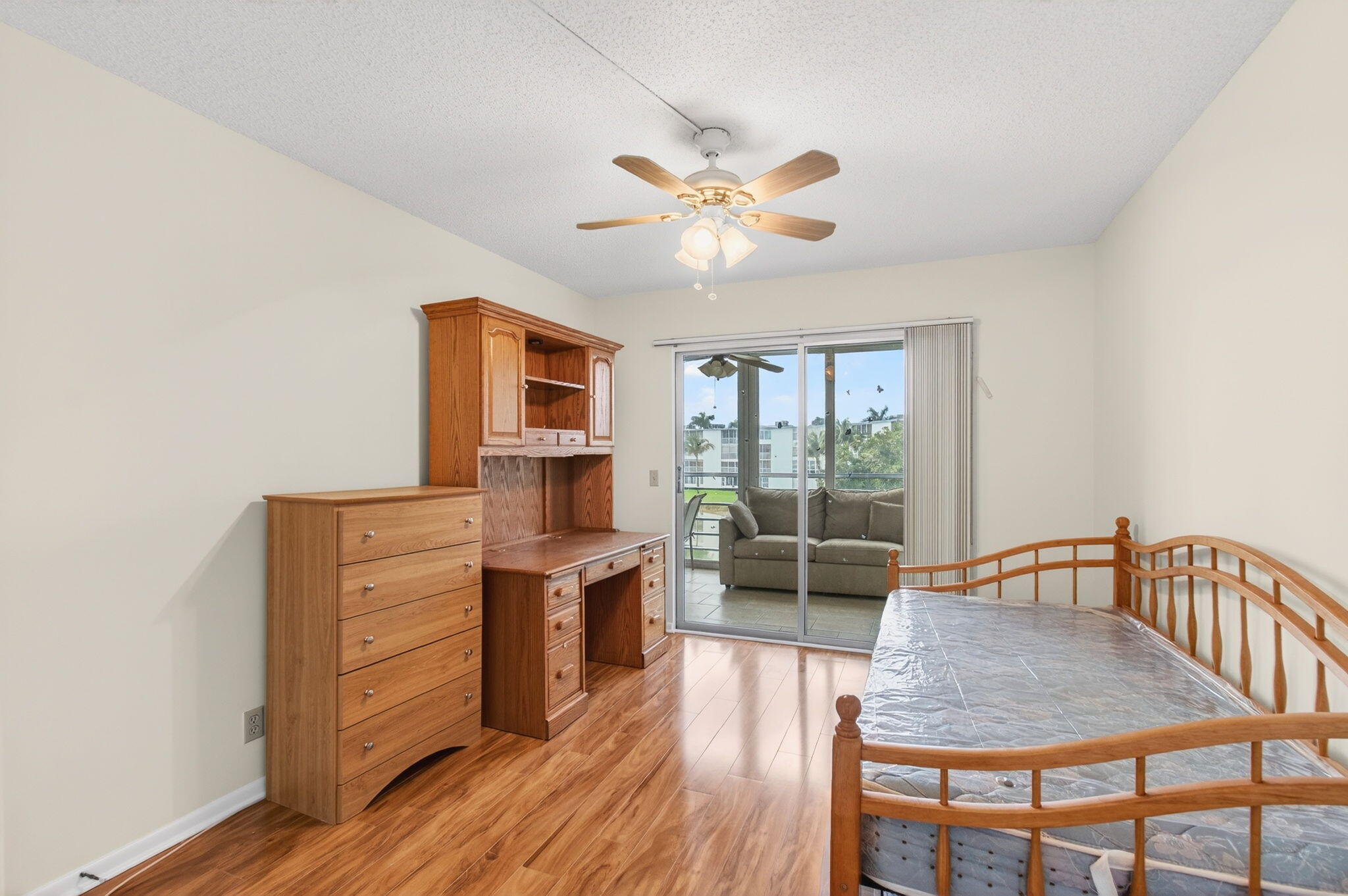 3007 Yarmouth C Boca Raton, FL 33434 - Photo 25 of 70 a dining room with furniture a window and wooden floor