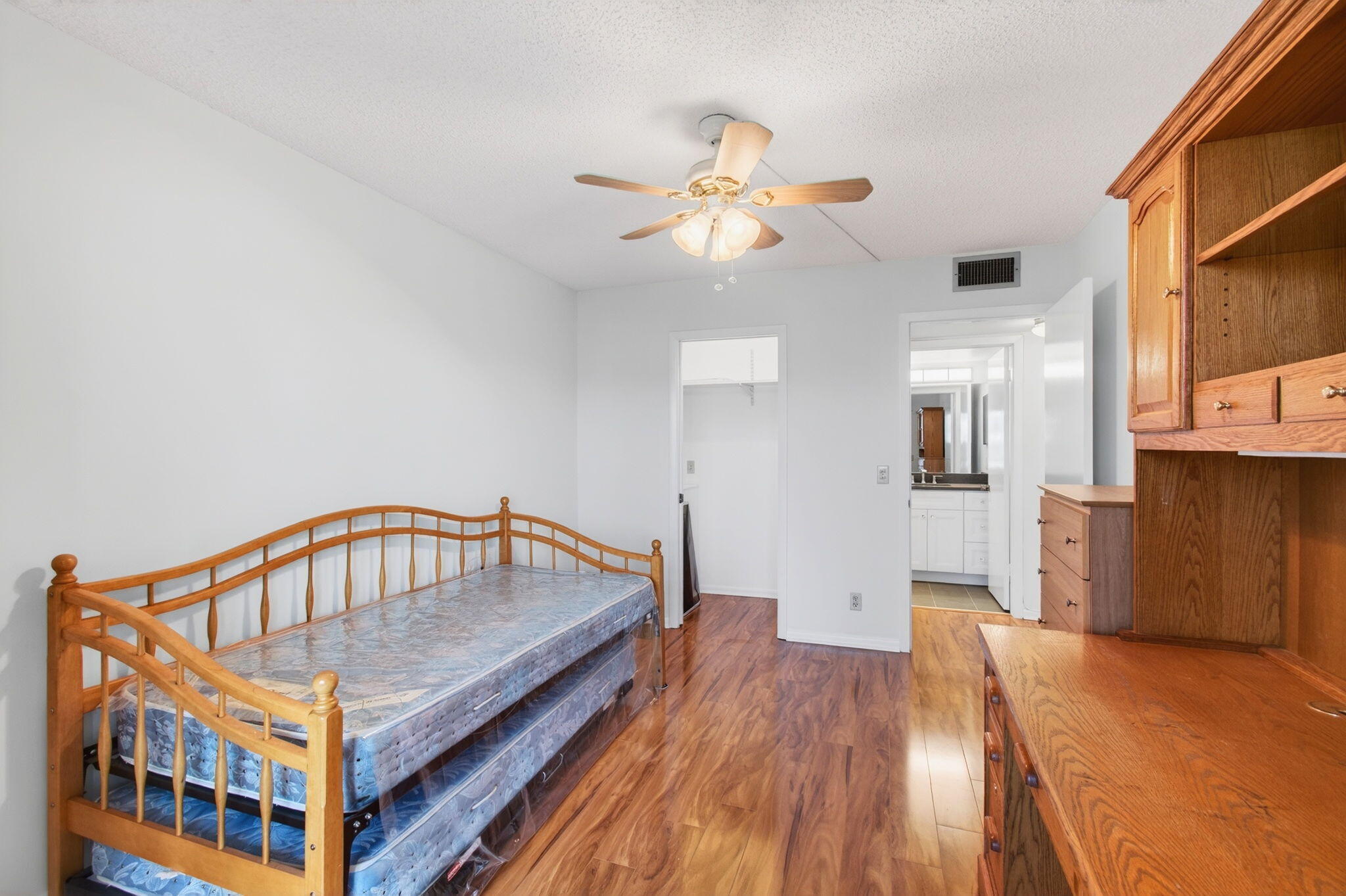 3007 Yarmouth C Boca Raton, FL 33434 - Photo 26 of 70 a view of a hallway with wooden floor and chandelier