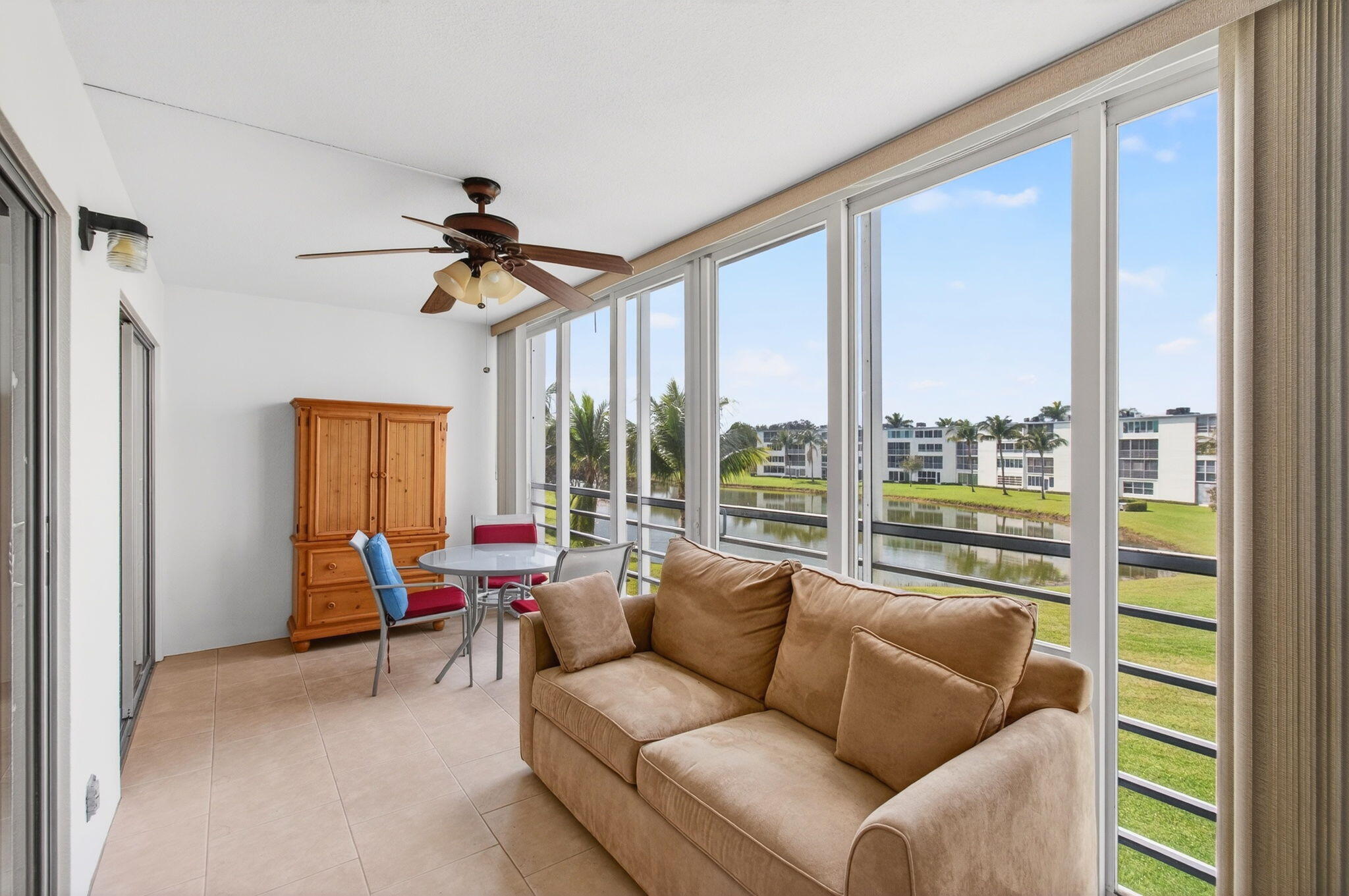 3007 Yarmouth C Boca Raton, FL 33434 - Photo 32 of 70 a living room with furniture and a large window