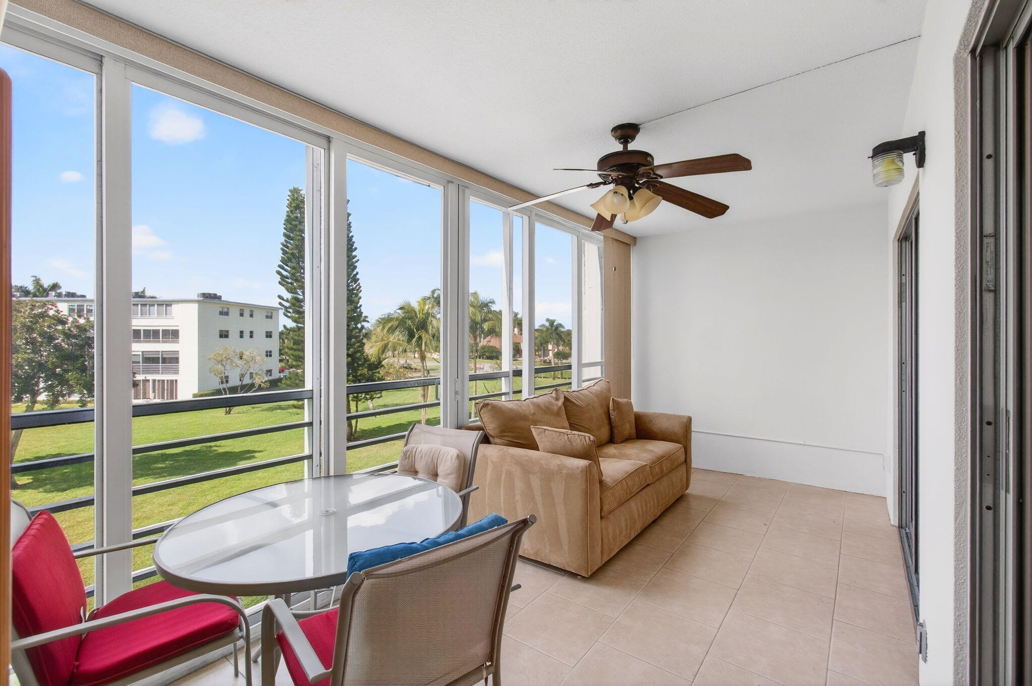 3007 Yarmouth C Boca Raton, FL 33434 - Photo 34 of 70 a living room with furniture and a large window