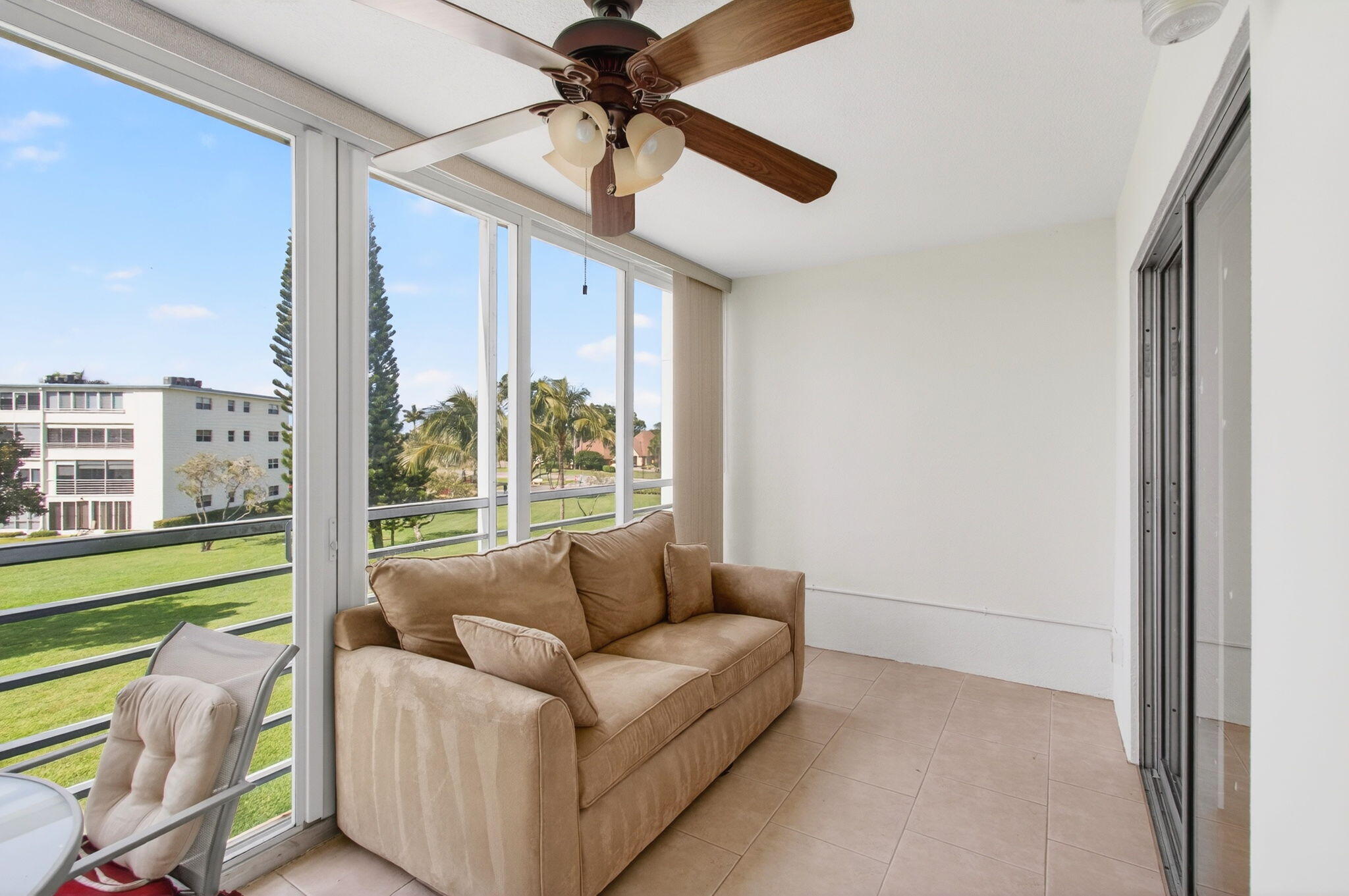 3007 Yarmouth C Boca Raton, FL 33434 - Photo 35 of 70 a living room with furniture and a large window