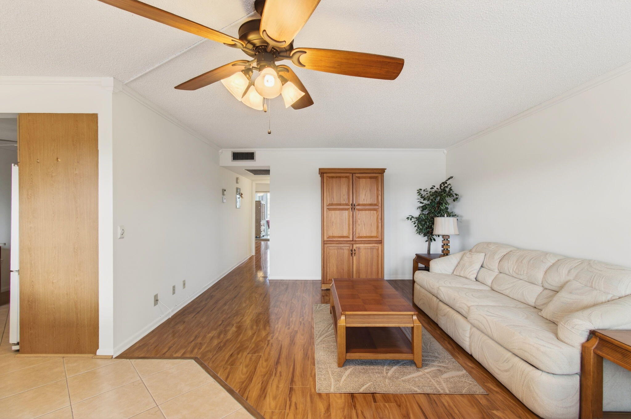 3007 Yarmouth C Boca Raton, FL 33434 - Photo 7 of 70 a living room with furniture and a chandelier