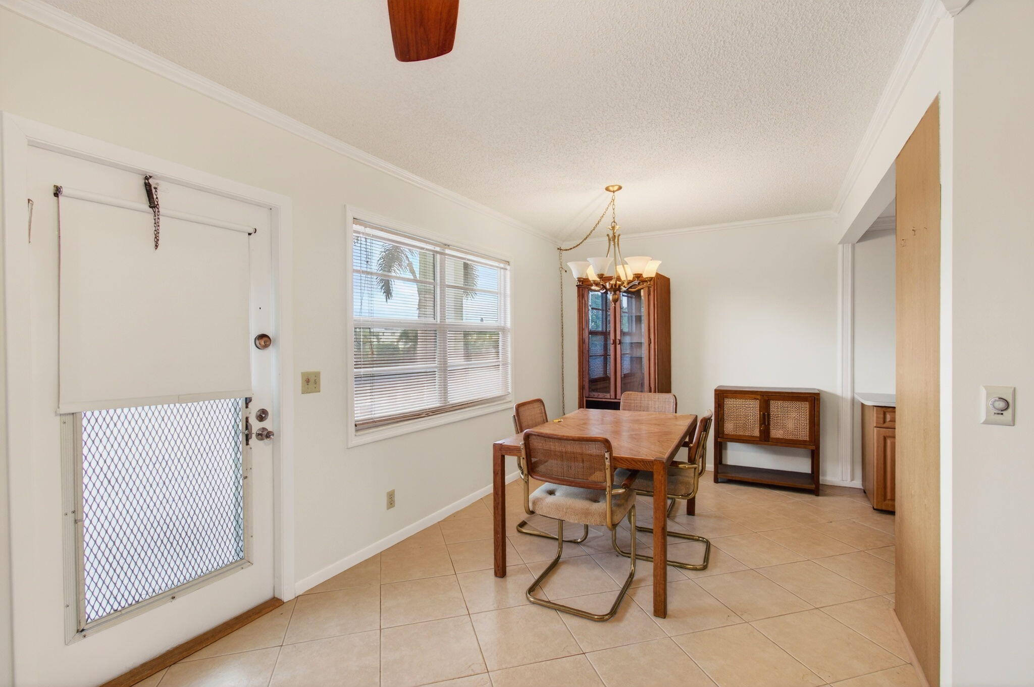 3007 Yarmouth C Boca Raton, FL 33434 - Photo 8 of 70 a dining room with furniture and window