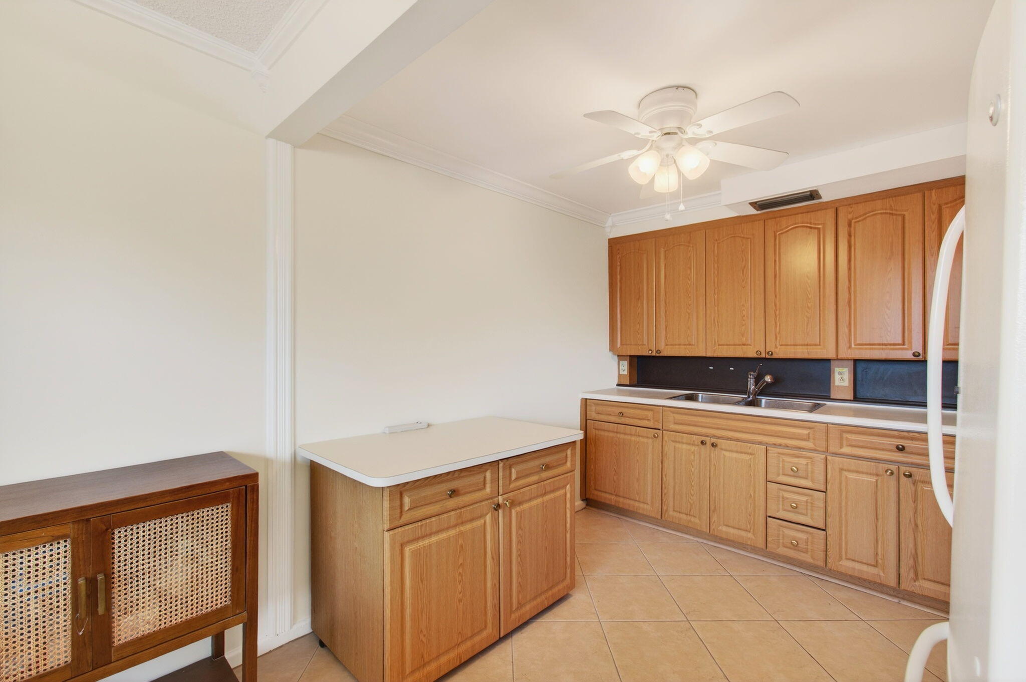 3007 Yarmouth C Boca Raton, FL 33434 - Photo 10 of 70 a kitchen with a sink and cabinets