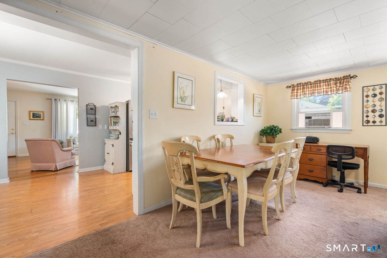 9 Stanton Road North Haven, CT 06473 - Photo 15 of 35 a view of a dining room with furniture and a large window