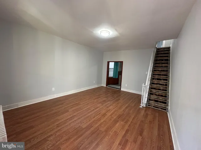 wooden floor in an empty room with a workspace