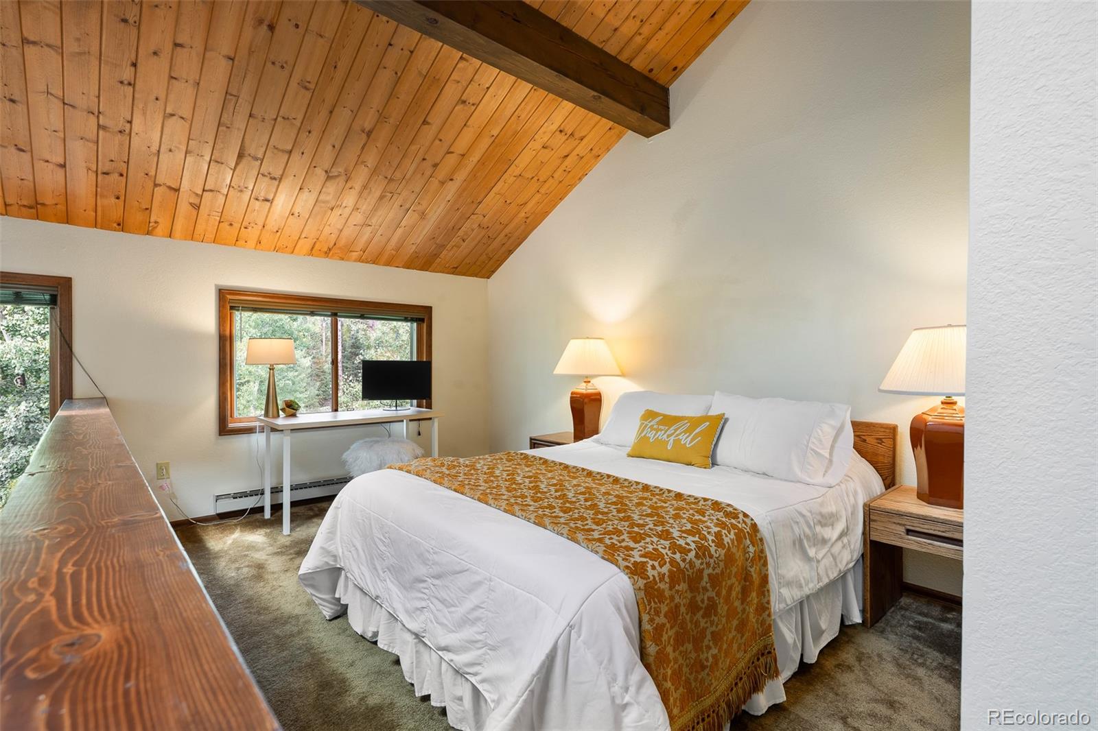 300 Kings Crossing Road, Unit B3 Winter Park, CO 80482 - Photo 18 of 38 a bed sitting in a bedroom next to a window with a balcony view