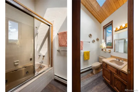 a view of bathroom with tub shower and mirror